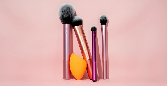 A range of makeup brushes and a sponge from Real Tecnniques